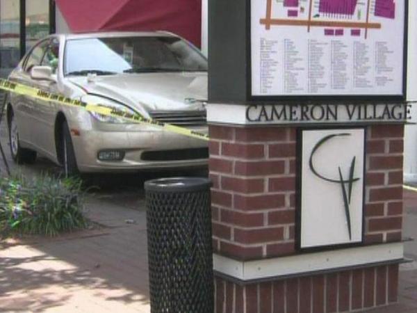 Four injured when car jumps curb at Cameron Village