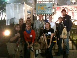Team WRAL posing in front of cart