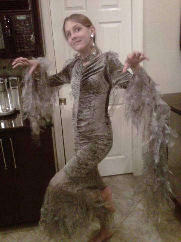 Amanda Lamb's daughter dresses as an angel/witch for Halloween.