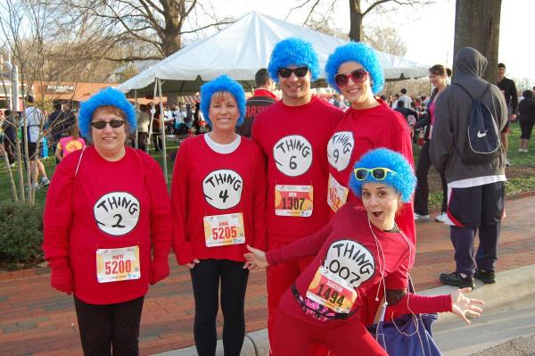 Racers often come in costume to the Krispy Kreme Challenge. The goal is to run about 2.5 miles to Krispy Kreme, eat a dozen donuts and run back. 