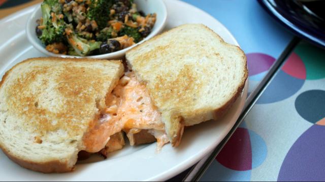 A grilled pimento cheese sandwich from Nofo at the Pig. It is accompanied by some broccoli salad. (Photo by Sarah Adams)