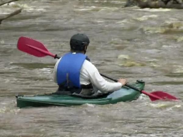 Man, kids rescued after canoe capsizes