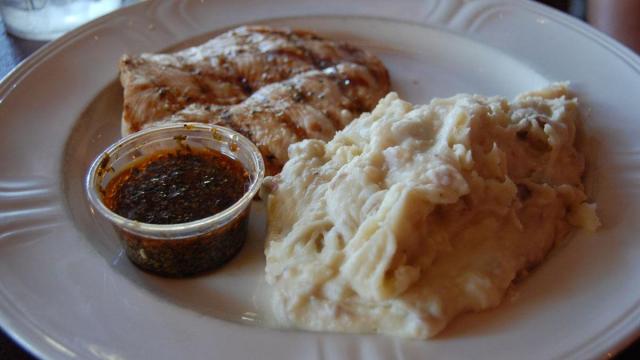 The char-grilled chicken and mashed potatoes at Oakwood Cafe in Raleigh.