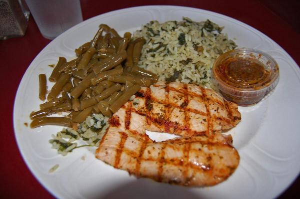The char-grilled chicken, spinach rice and green beans at Oakwood Cafe in Raleigh.