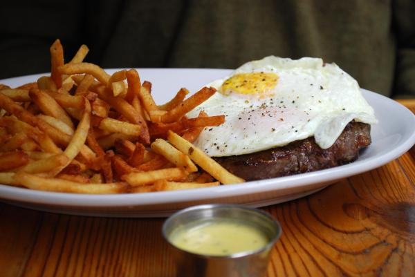 Steak frites topped with two eggs from Rue Cler in Durham.