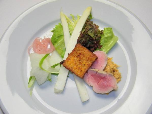 Course 2: Mustard Poached Pork Tenderloin with Shellfish Confiture, Salad of Pickled Vegetables, Mixed Greens, Fresh Herbs & Mustard Polenta Croutons (Photo by Judy Royal)