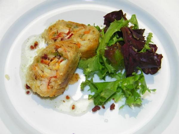 Course 2: Lobster & Lump Crab Strudel with Crispy Johnson Co. Ham, Mesclun Salad & Bacon Vinaigrette (Photo by Judy Royal)