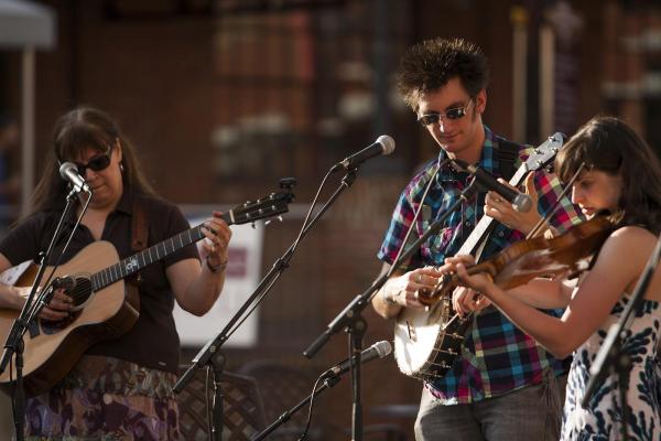 From left: Beth Williams Hartness, Adam Hurt and Stephanie Coleman perform during Back Porch Music on the Lawn Series at American Tobacco Campus.