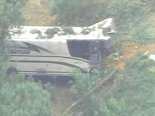 Bus Drives Off Interstate, Crashes Through Woods