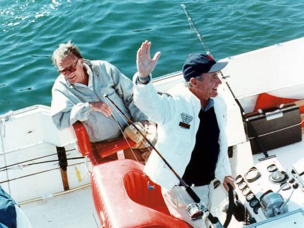 Rev. Billy Graham and President George H.W. Bush enjoy a fishing trip off the coast of Maine. (Photo courtesy of Billy Graham Evangelistic Association)