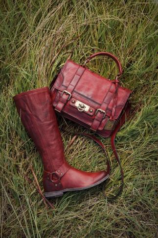Town & Country trend: Frye "Cameron" small leather satchel in burnt red ($398) and a "Phillip" harness tall boot with zipper in red ($328) (Images courtesy of Belk)
