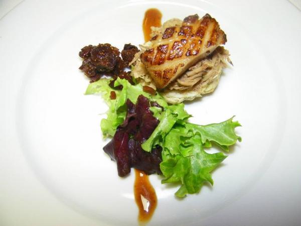 Course 2: Pork Rib Confit with Black Currant Biscuit, Poor Man’s Pork Belly Foie Gras, Sweet Tea Braised Figs & Mesclun Greens. (Photo by Judy Royal.)