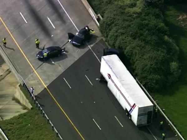 Semi-truck strikes Durham police car on I-85