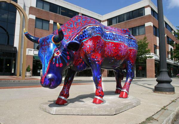 A life-size cow sculpture from a previous CowParade