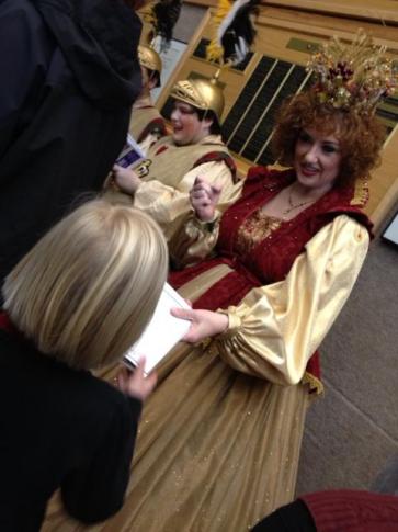 Cast members sign autographs after its popular holiday show Cinderella