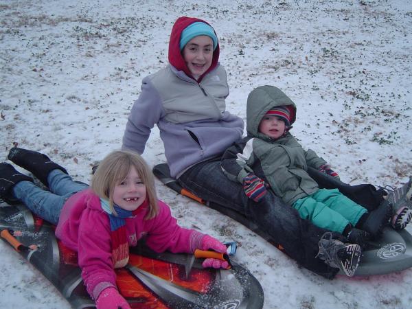 Photo by: Laura Sutton. Sutton kid's enjoy new sleds!