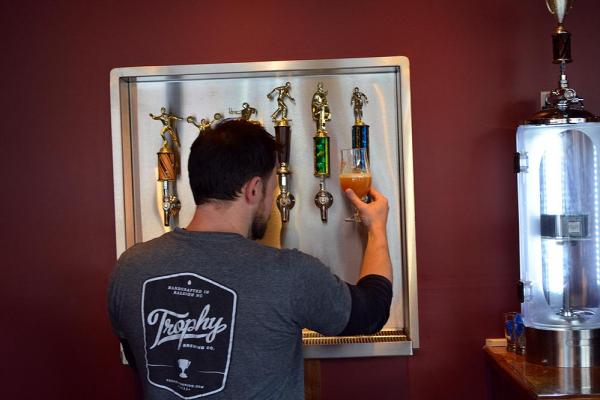 Head brewer Les Stewart takes a look at the beer at Trophy Brewing Company in Raleigh.