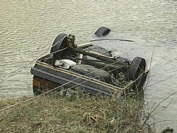 The victims' car flipped down a hill before plunging into the creek on its roof. 