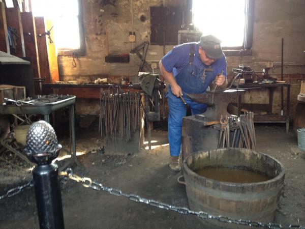 Blacksmith at work at Antler Hill Village, Biltmore estate
