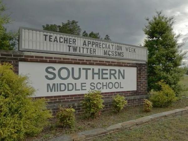 Moore teacher fired, arrested 