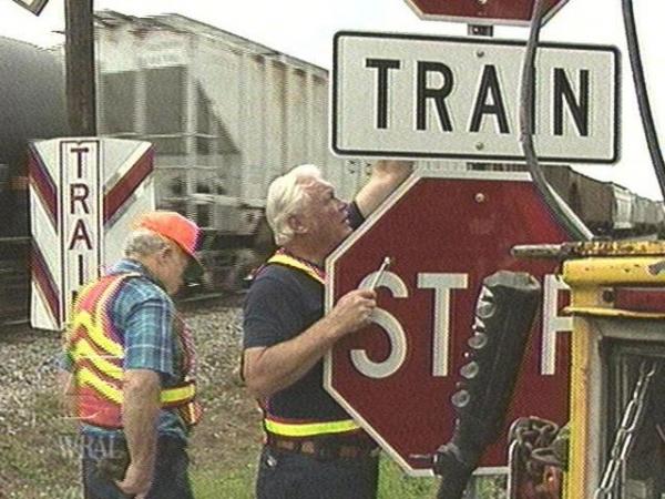 NCDOT workers installed an additional stop sign at a Raleigh railroad crossing where two people were killed this week. There are now eight stop signs there. (WRAL-TV5 News)
