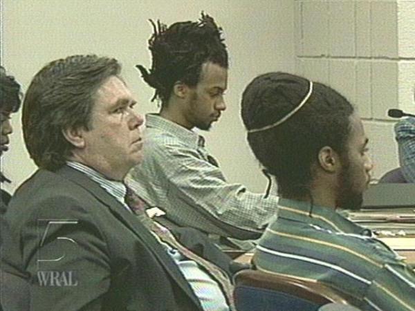 Tilmon Golphin (rear, center) and his brother Kevin (right), listen to testimony in the sentencing phase of their double murder trial in Fayetteville. (WRAL-TV5 News)