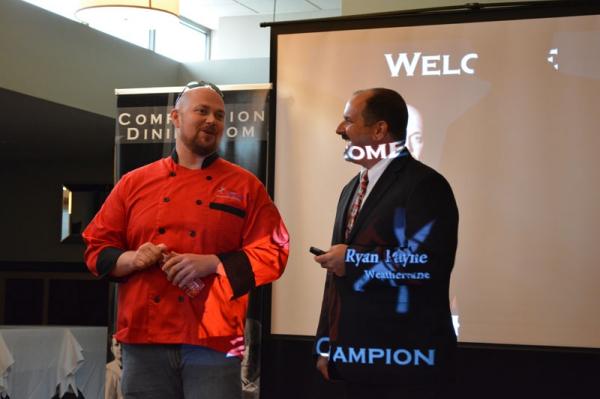 Competition Dining's Jimmy Crippen welcomes 2012 Fire in the Triangle winner Ryan Payne of Weathervane.