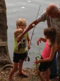 Lynda Loveland's kids catch some fish at her family's home.