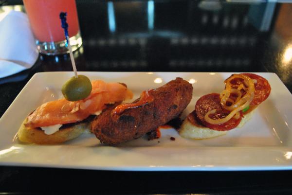 A trio from Taberna Tapas during Dishcrawl Durham: smoked salmon and goat cheese, chicken and bacon croquette, Spanish chorizo with avocado.
