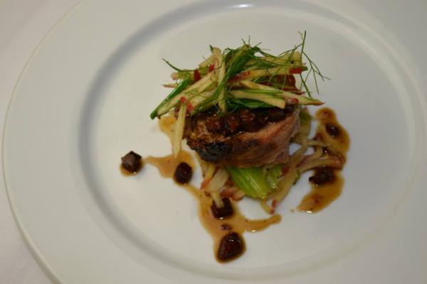 Course 3: Braised Cheshire Picnic Roulade with Steel Cut Oat & Tasso Ham Stuffing, Warm Apple Celery Salad, Pepsi Andouille Reduction (Image from Competition Dining)