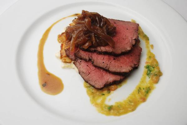 Course 2: Smoky Hogwash Marinated Certified Angus Beef® Coulotte Steak, El Toro Balsamic Onions, Andouille El Toro Creamed Corn, Tomato Jam, Potato Leek Hash, Hogwash Ashe County Herbed Cheese Demi (Image from Competition Dining)