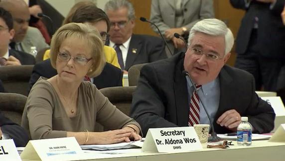 DHHS Secretary Aldona Wos and Chief Information Officer Joe Cooper testify before a General Assembly oversight committee on Oct. 8, 2013.