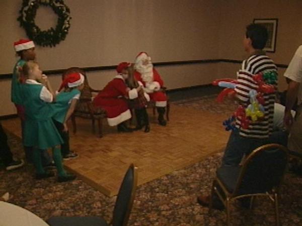 Santa Claus paid a special visit to children at a holiday party at Embassy Suites-Crabtree Valley Sunday.(WRAL-TV5 News)