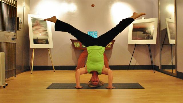 Instructor Beth Shelly demonstrates a pose at Vault Yoga.