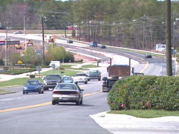 As crews repaint lines, each lane will lose about a foot in width.(WRAL-TV5 News)