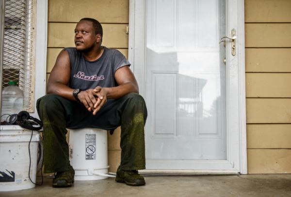 Mike McFadden sits on his porch in High Point. In the mid-1990s, McFadden said, “you couldn’t even come down this street after about 6 o’clock, when it got dark.”