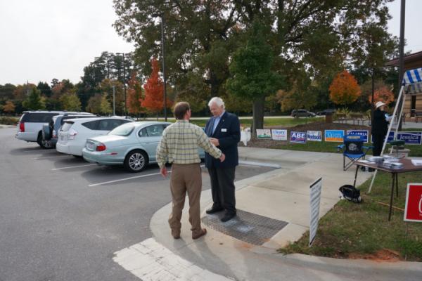 Tom Bradshaw, a Democratic candidate for state Senate, spent Tuesday morning greeting voters outside the senior center at Millbrook Exchange Park.