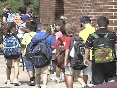 Students leaving school - backpacks