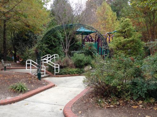 The playground mixes a garden and play structures.