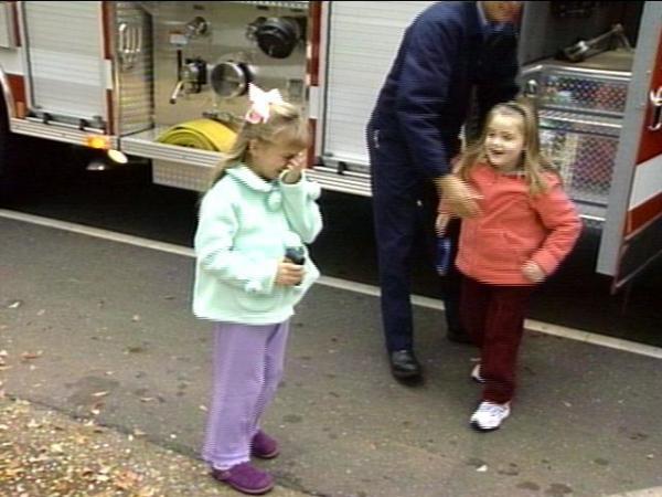 Two happy little girls bounced out of the firetruck.(WRAL-TV5 News)
