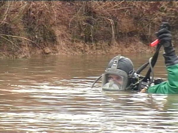 Divers search a Sampson County pond Saturday for any clues about Myers' disappearance.(WRAL-TV5 News)