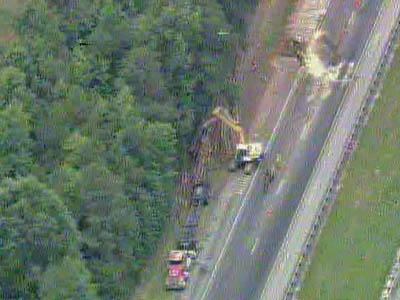 Log truck overturned on I-95