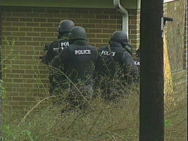 Durham's Selective Enforcement Team fire tear gas into the house before entering.