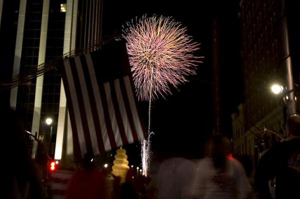 Fireworks explode over Fayetteville Street to end the day-long Raleigh Wide Open event.