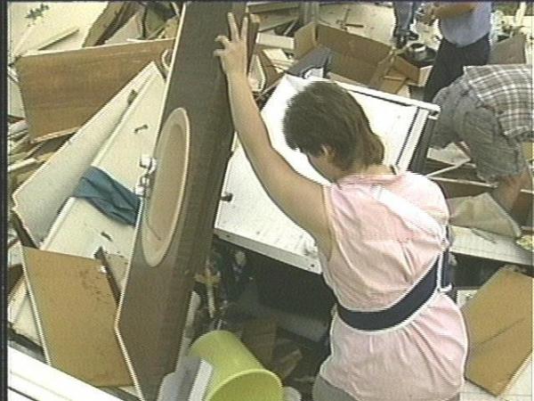 Sheila Jordan sorts through what's left of her home.