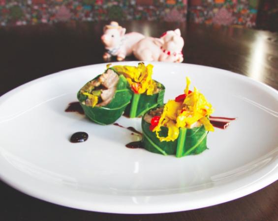 Heritage Cheshire Pork Belly-Collard Wrap with Collard Stem Slaw, Chowchow and Pomegranate Reduction (Sarah Arneson)