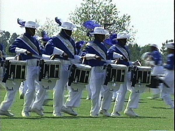 A line of drummers march prior to Friday's competition