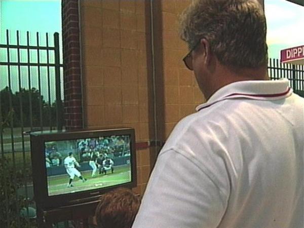 An HDTV set on display at Friday night's Durham Bulls game.