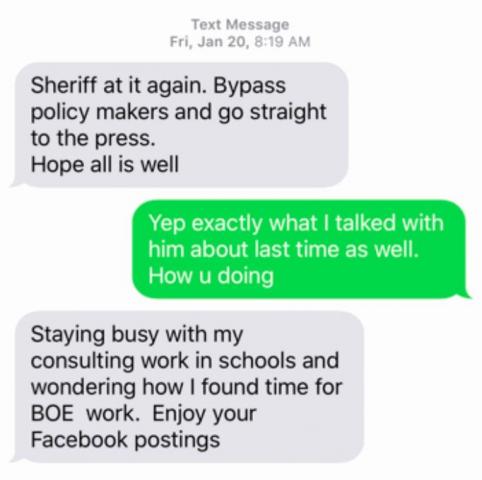 Wake County Commissioners Chairman Sig Hutchinson texts with a former school board member about the sheriff. 