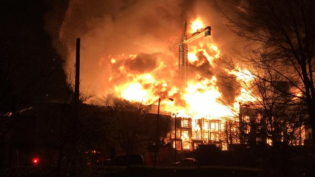 Night sky glows red as apartment building burns in downtown Raleigh
